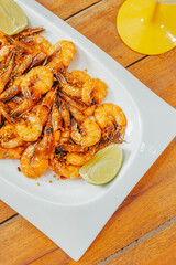 Colorful Food Beach Appetizer Starts Snacks Fresh Delicious Menu Recipe Meal Meat Chicken Fries Fish Seafood Beer on a wooden table