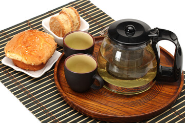 Obraz na płótnie Canvas cake,cup and teapot of tea on white background