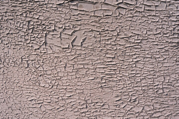 Old cracked paint on the concrete wall