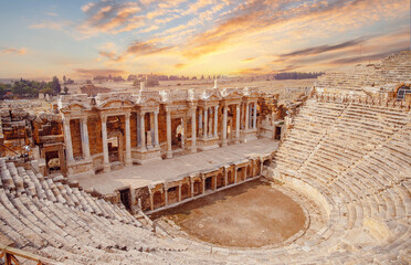 Amphitheater in Hierapolis ancient city in Pamukkale Turkey banner sunset - obrazy, fototapety, plakaty