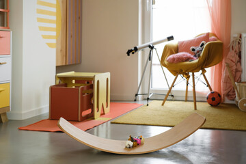 Kids play room, nobody. Nice sunny bright interior at home. Play and rest and create, store things...