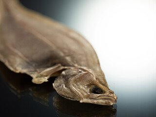 dried flounder on a black background