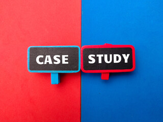Colored wooden board with the word CASE STUDY on a red and blue background