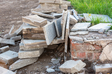 Dismantling of old tiles, repair on the street.