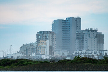 cityscape view of tall buildings, apartment blocks, condominiums at the coastal town of Bloubergstrand, Cape Town, South Africa