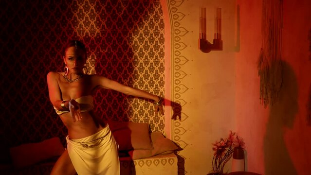 sexuality and femininity of amazing beautiful concubine in arabic harem, woman is dancing