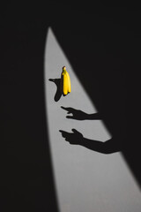 silhouette catching a banana