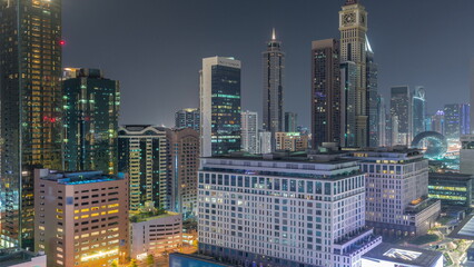Dubai International Financial district aerial all night timelapse. View of business and financial office towers.