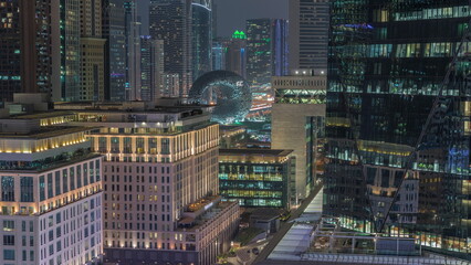 Dubai International Financial district aerial night timelapse. View of business and financial office towers.
