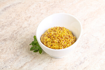 Grain mustard sauce in the bowl