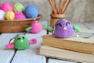 Colored crochet bird. Toy for babies or trinket.  Handmade gift. DIY crafts concept.