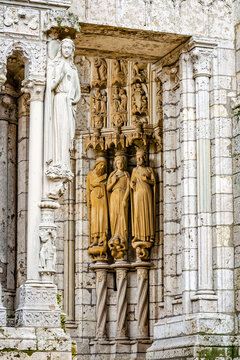 Statues on side wall of Cathedral Our Lady of Chartres, France - one of the finest examples of French Gothic architecture, constructed during the 13th century.