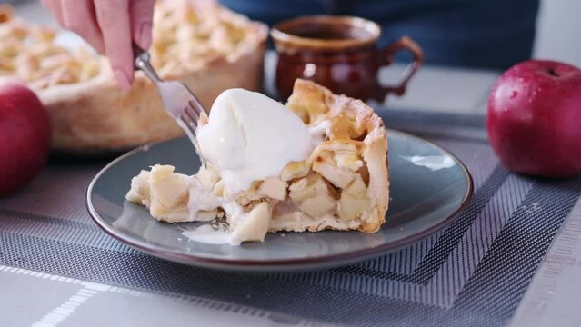 Apple pice cake preparation series - woman taking piece of a pie