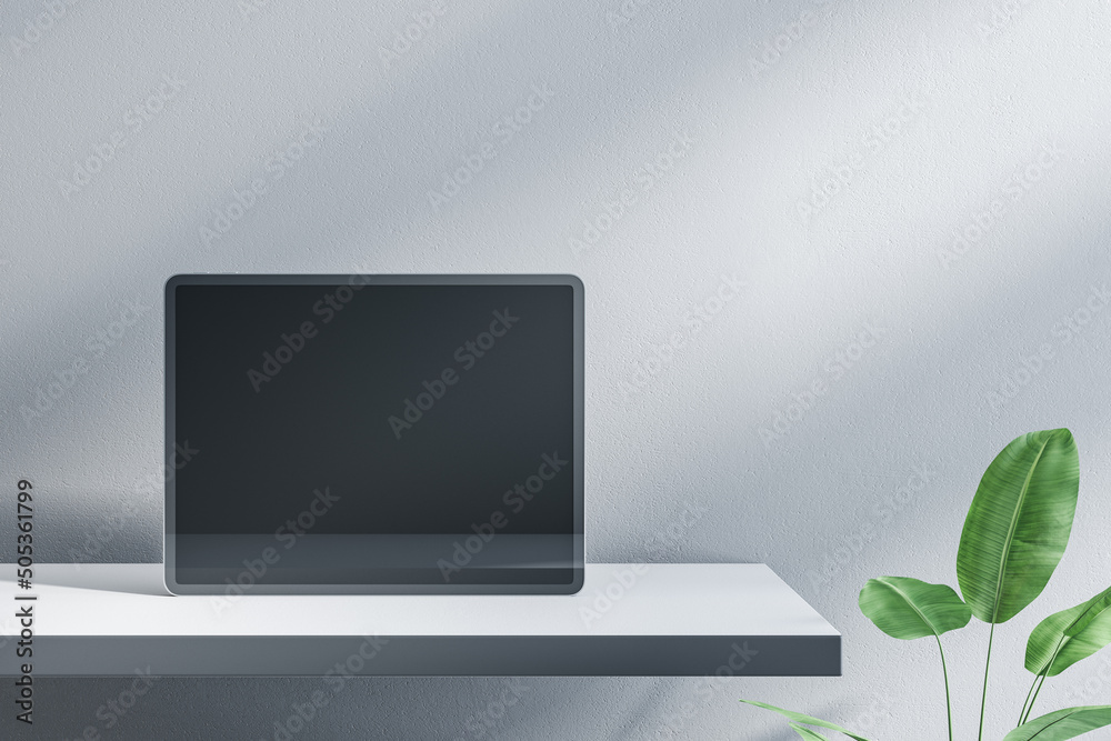 Poster close up of empty tablet screen on designer office desktop. decorative plant and concrete wall backg