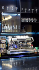 Empty bar with glasses and coffee machine