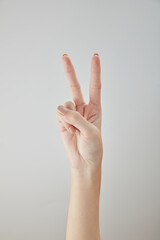 A front view of hand posing in white background for cosmetic advertising