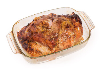 Baked pork in glass baking pan on white background