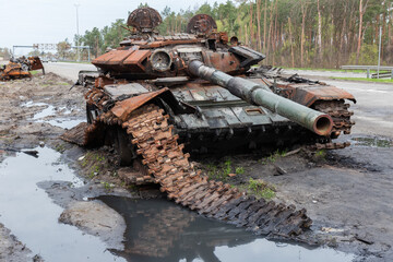 Destroyed russian tank on roadside in invasion of Ukraine