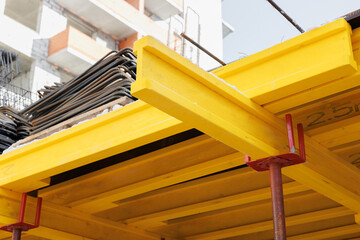 construction of an industrial plant floors with yellow i-beams. Preparing the formwork for pouring...