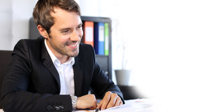 businessman smiling working in office - Banner with copy space