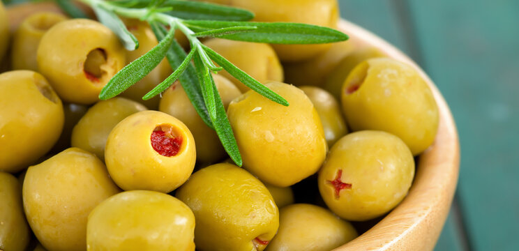 Fresh healthy green olives with rosemary. Organic mediterranean cooking banner.