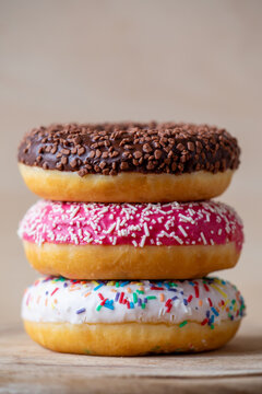 Sweet colorful donut cakes. Unhealthy junk food sugary dessert.