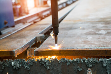 Auto machine welding and cutting steel plates with spark light. Steel Manufacturing Industry.