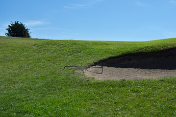 Terrain de golf et rateau