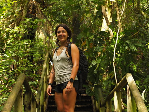 YOUNG WOMAN HIKING IN THE NATIONAL PARK OF MANUEL ANTONIO IN COSTA RICA
