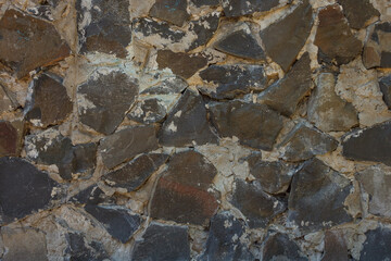 A stone masonry for a texture or a background. A fragment of the wall