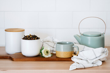 Fototapeta na wymiar Ceylon tea in mug and jars with kettle