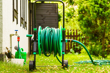 Garden hose for watering plants in garden