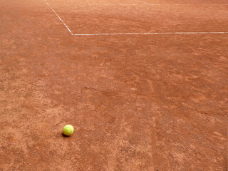 Tennis clay court with line and yellow ball