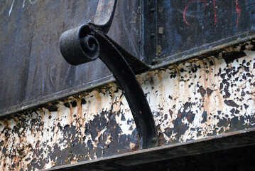 Ornate Iron Bracket on Old Bridge 