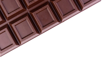 A bar of dark chocolate on a white background.Copy space.
