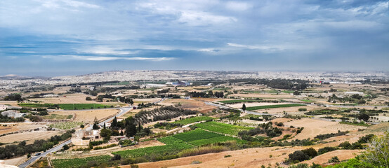 View of the capital city of Valletta, its surroundings and the Mediterranean Sea on the horizon. Picture from the fortress walls of Mdina, Malta island.