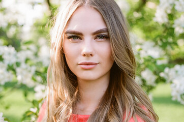 Fototapeta premium Beautiful young woman in summer garden. Beauty summertime. Film photography