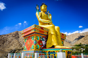 The Statue of Buddha (Maitreya) at Likir Gompa (Monastery) against clear blue sky in Ladakh India