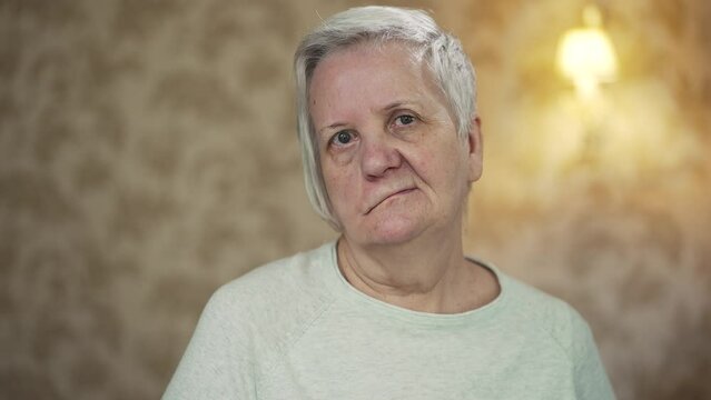 Elderly woman with facial paralysis