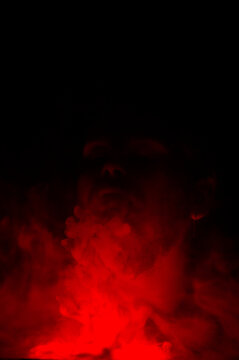 A Man In Red Smoke. Macro