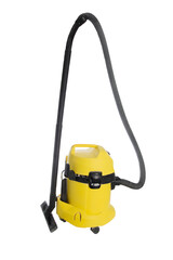 Yellow construction vacuum cleaner with a suction hose for liquids and construction garbage on a...