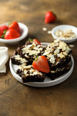 Traditional homemade brownie with almond and strawberry