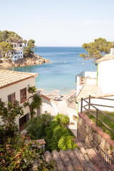 Small beautiful town on Mediterranean sea coast with beach view and clean transparent blue water surrounded with mountains and pine trees. Amazing place to have happy summer vacations