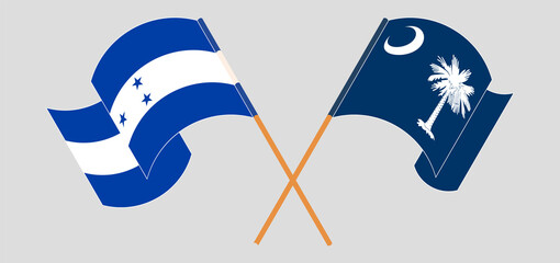 Crossed and waving flags of Honduras and The State of South Carolina