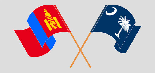 Crossed and waving flags of Mongolia and The State of South Carolina