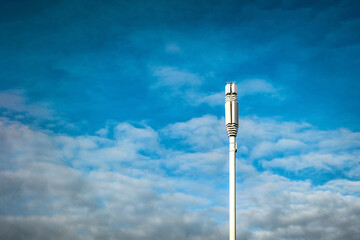 british mobile network operator mast over the blue sky