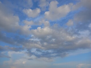 Naklejka na ściany i meble stratocumulus cloud with blue sky shining sun from the top