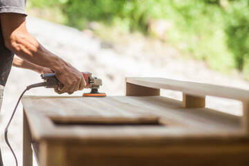 smooth wood surface with sandpaper machine