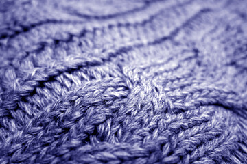Warm knitting texture with blur effect in blue tone.