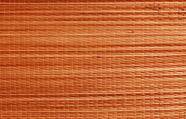 Natural bamboo wallpaper texture in orange color.